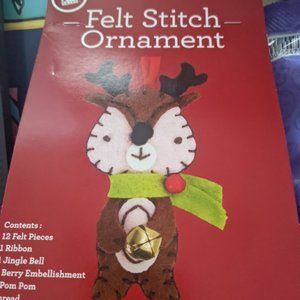 Felt stich Christmas ornament-never opened.